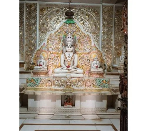 Anantnath Bhagwan idol on an ornate jewelled throne in a Jain sanctum
